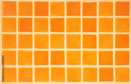 Orange Tiles on the wall.