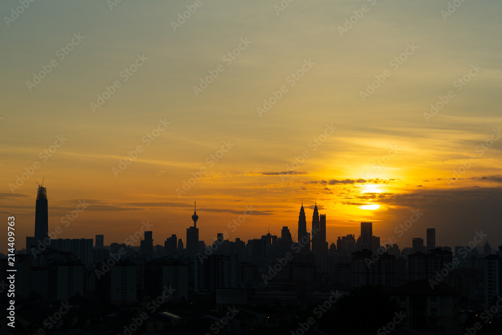 Majestic sunset over KL Tower and surrounded buildings in downtown Kuala Lumpur, Malaysia.	