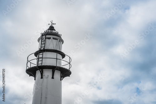 Light house with clouds in the background