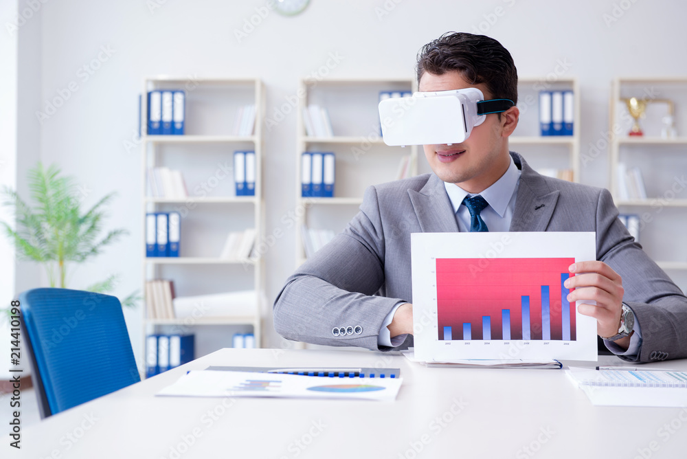 Businessman with virtual reality glasses in the office Businessman with virtual reality glasses in the office