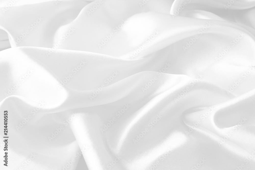 White silk texture luxurious satin for abstract background. beautiful white fabric, soft focus