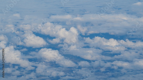 Fototapeta Naklejka Na Ścianę i Meble -  view of the clouds through window of an airplane