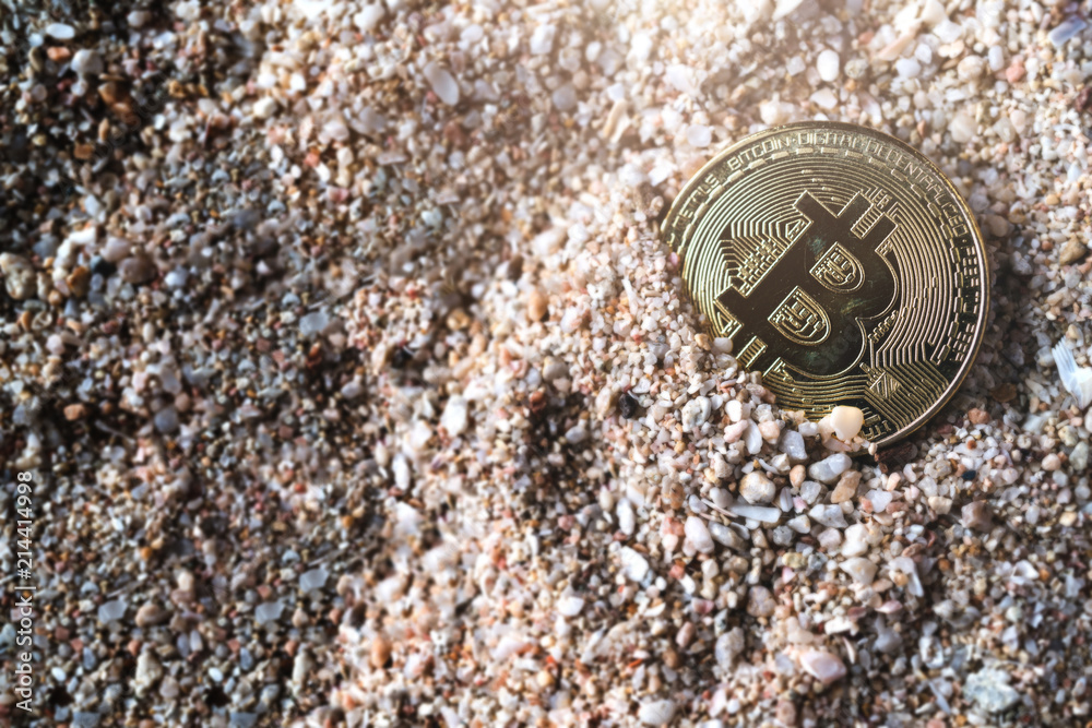 crypto currency coin symbol sunk in sand sea texture floor business financial ideas concept crypto currency coin symbol sunk in sand sea texture floor business financial ideas concept