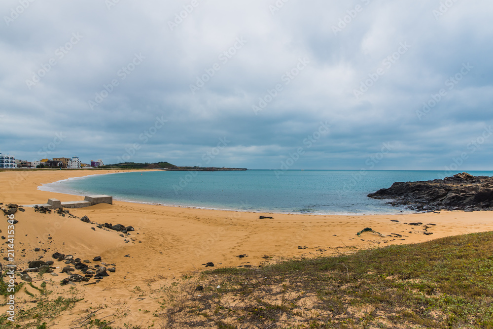 Sandy beach with ocean and clouds in Shanshui, Penghu, Taiwan Sandy beach with ocean and clouds in Shanshui, Penghu, Taiwan