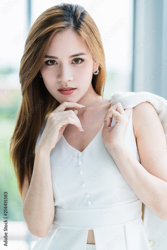 beautiful asian woman portrait image in white elegance dress white room background beautiful asian woman portrait image in white elegance dress white room background