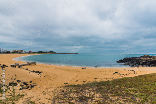 Sandy beach with ocean and clouds in Shanshui, Penghu, Taiwan