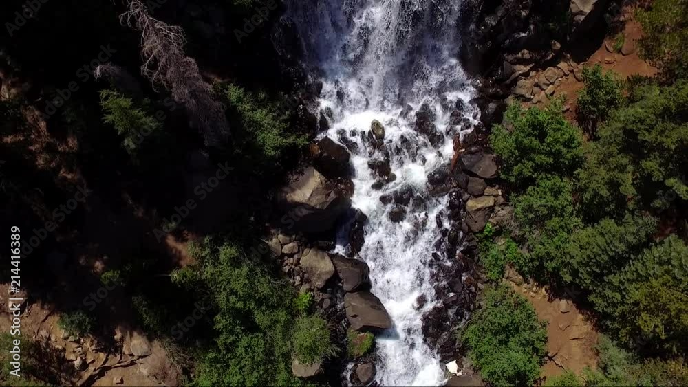 A hovering drone shot looking directly down on a water fall in Twin Lakes California A hovering drone shot looking directly down on a water fall in Twin Lakes California