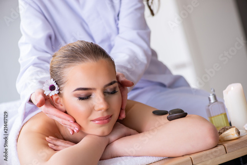 Woman during massage session in spa