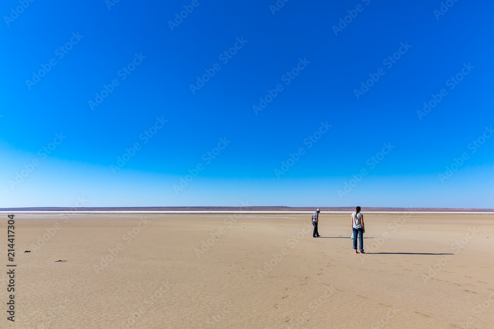 The brilliant landscapes of the lovely walkings on the Tuzbair salt dry lake, in Mangystau, Kazakhstan The brilliant landscapes of the lovely walkings on the Tuzbair salt dry lake, in Mangystau, Kazakhstan