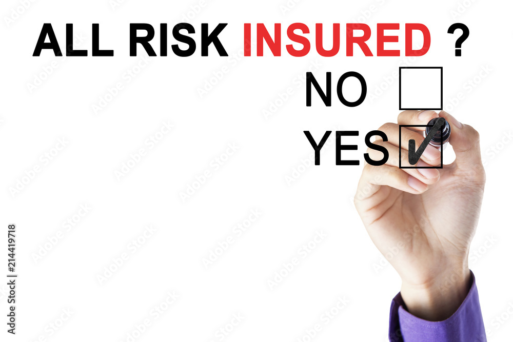 Businessman's hand approving all risk insured Businessman's hand approving all risk insured