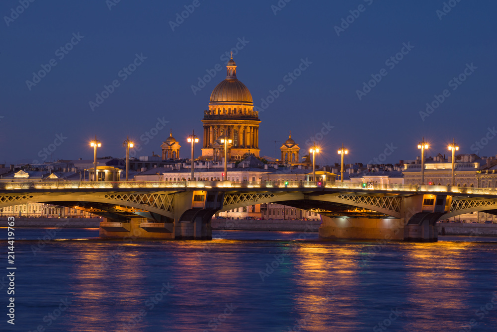 The Annunciation Bridge and the dome of St. Isaac Cathedral in the night scenery. Saint-Petersburg, Russia