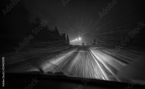 view from the car window at night in bad weather in winter snow and rain and poor visibility