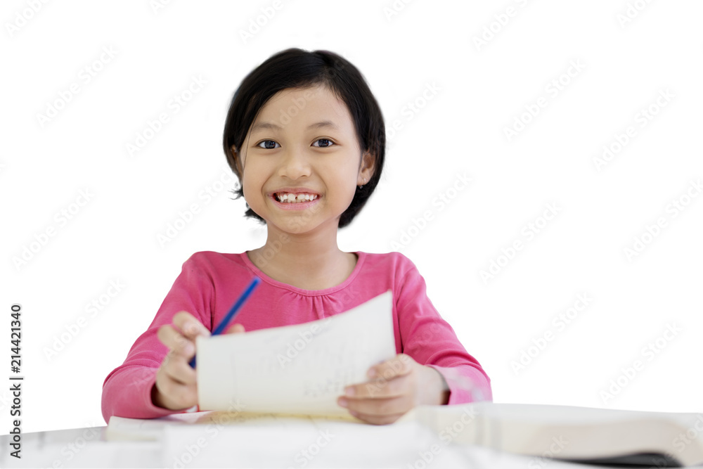 Happy little girl writing notes on a paper Happy little girl writing notes on a paper