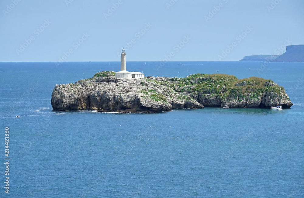 View of the lighthouse of the Faro De La Isla De Mouro island in Santander, Cantabria, Spain