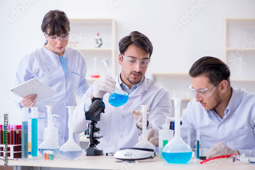 Team of chemists working in the lab