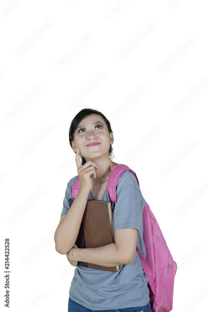 Pretty girl thinking an idea on studio