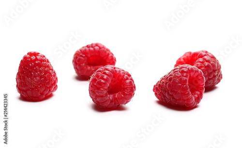 pile raspberries isolated on white