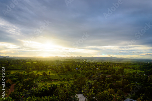 Landscape of cloudy  mountain and forest with sunset in the evening from top view.