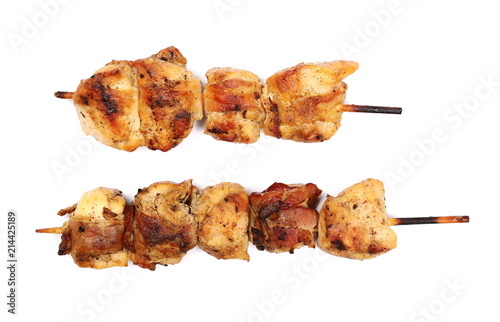 Grilled chicken pieces wrapped in bacon, isolated on white
