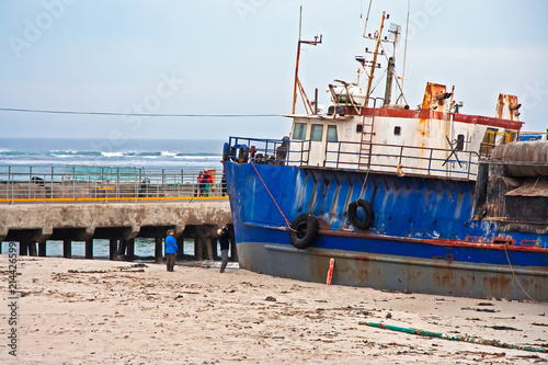 Ship stranded on beach photo