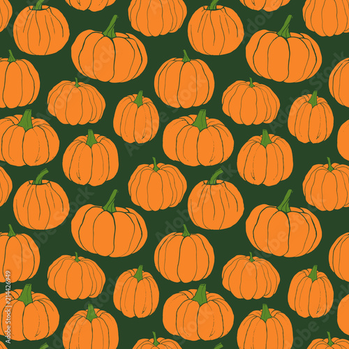 Pumpkins pattern. Autumn seamless vector pattern with hand drawn pumpkins on green background.