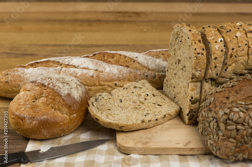 Whole grain bread on wooden background, healthy for dieting or breakfast