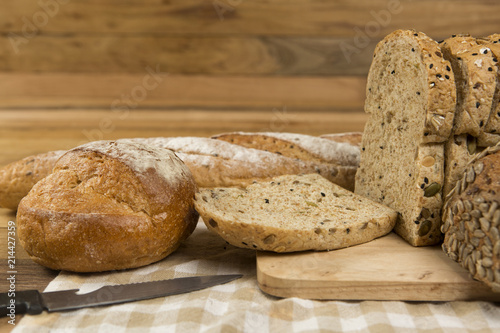 Whole grain bread on wooden background, healthy for dieting or breakfast