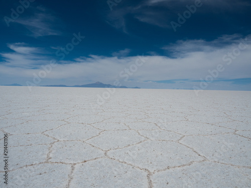 Uyuni Salt flats with bright blue sky and reflections