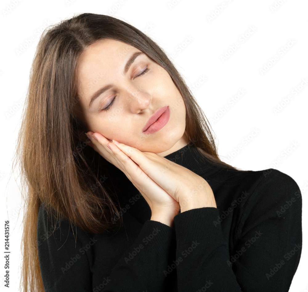 Beautiful young woman sleeping tired dreaming and posing with hands together Beautiful young woman sleeping tired dreaming and posing with hands together