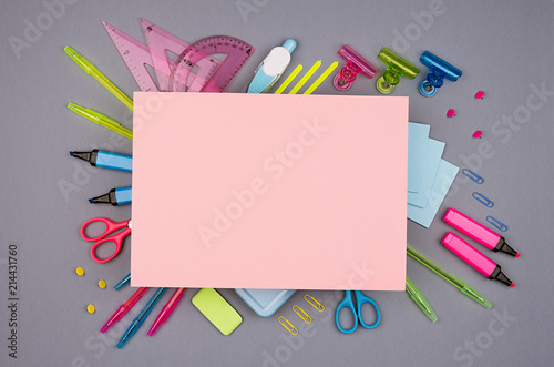 Wallpaper Mural Neon multicolor stationery set and blank pink paper for text on grey background, flat lay. Torontodigital.ca