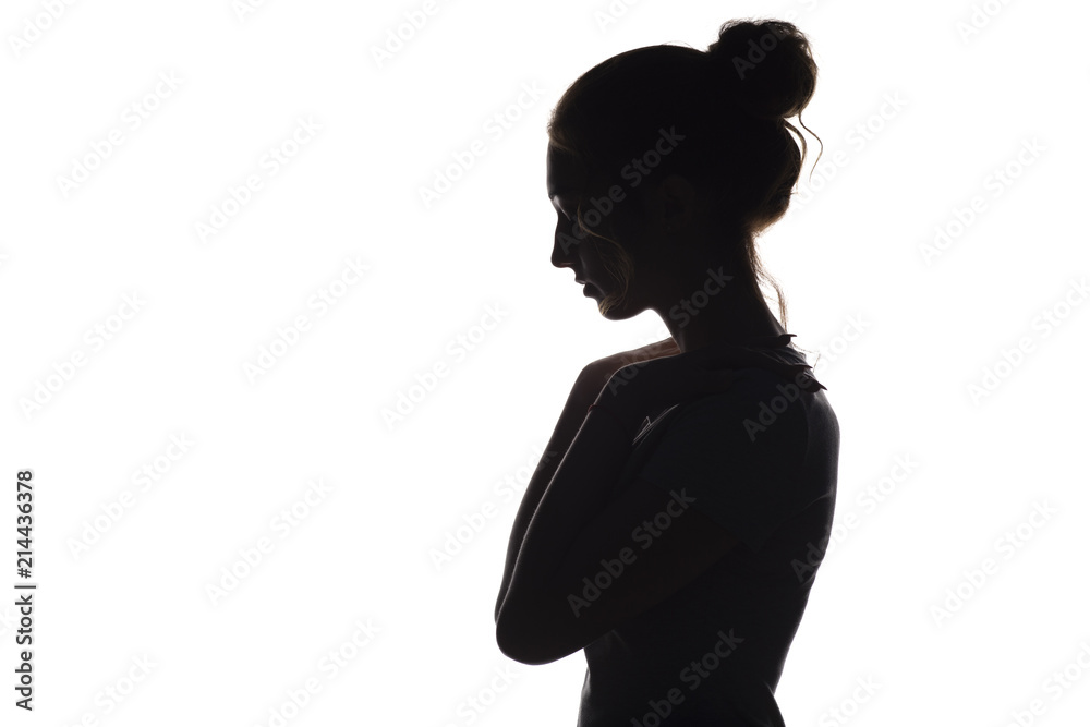 silhouette of a young woman on a white isolated background, face profile of a beautiful girl