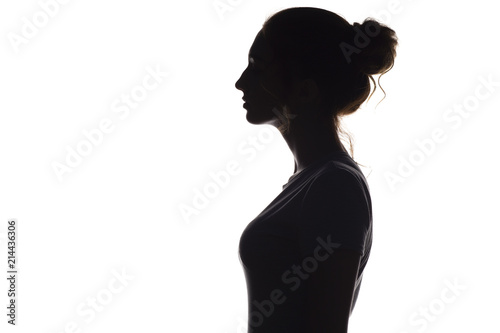 silhouette profile of young woman on a white isolated background