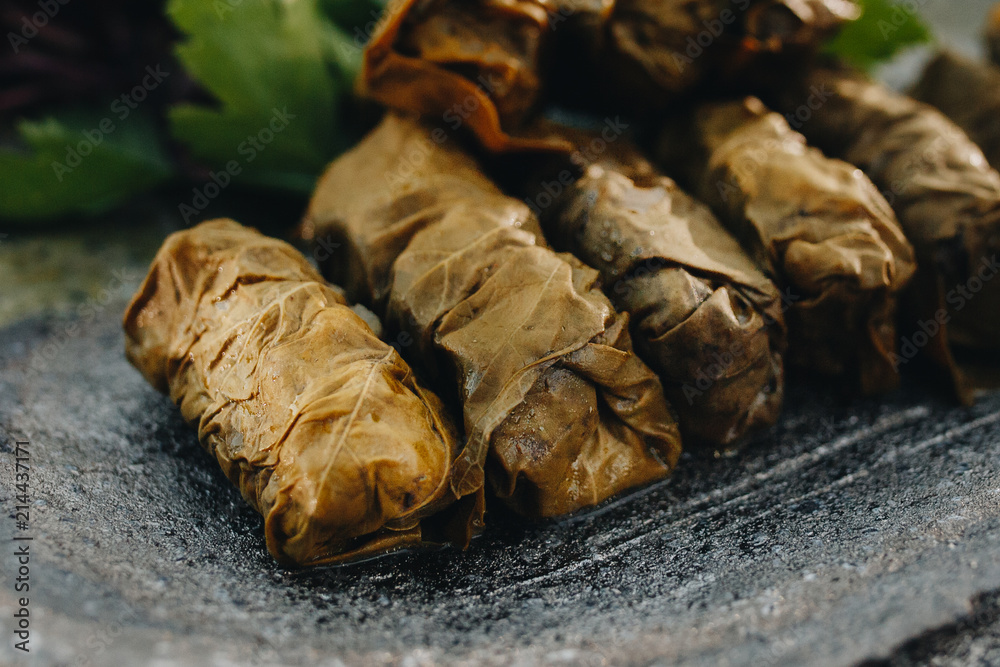 Caucasian traditional dish meat wrapped in grape leaves called dolma Caucasian traditional dish meat wrapped in grape leaves called dolma