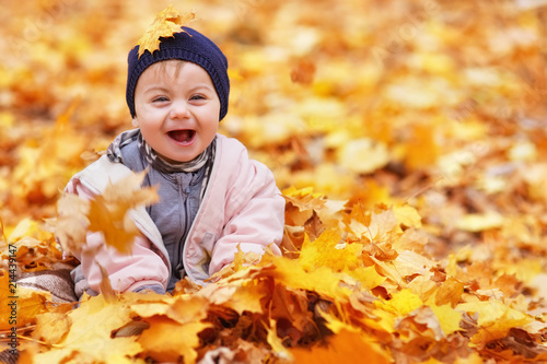 portrait of little baby girl in the autumn park