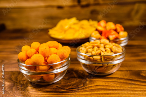 Different snacks for beer on wooden table