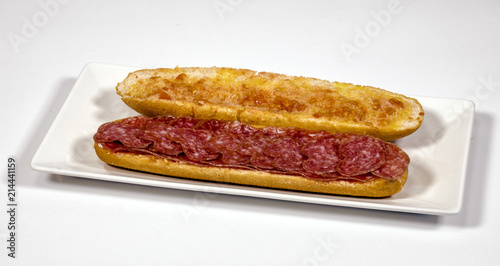 pa amb tomaquet amb fuet, bread with tomato and a typical sausage of Catalonia photo
