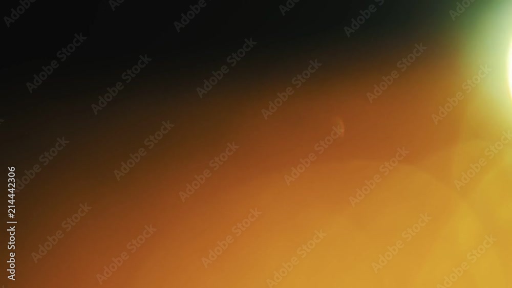 Golden bokeh moves on a dark background in various directions. Golden bokeh moves on a dark background in various directions.