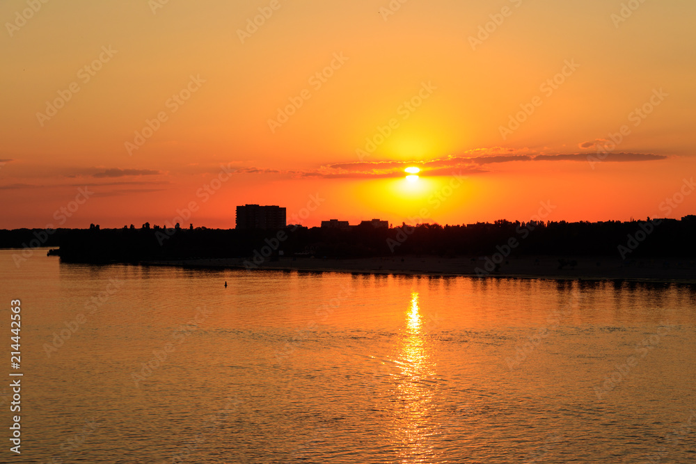 Orange sunset over a river Dnieper in Kremenchug city, Ukraine