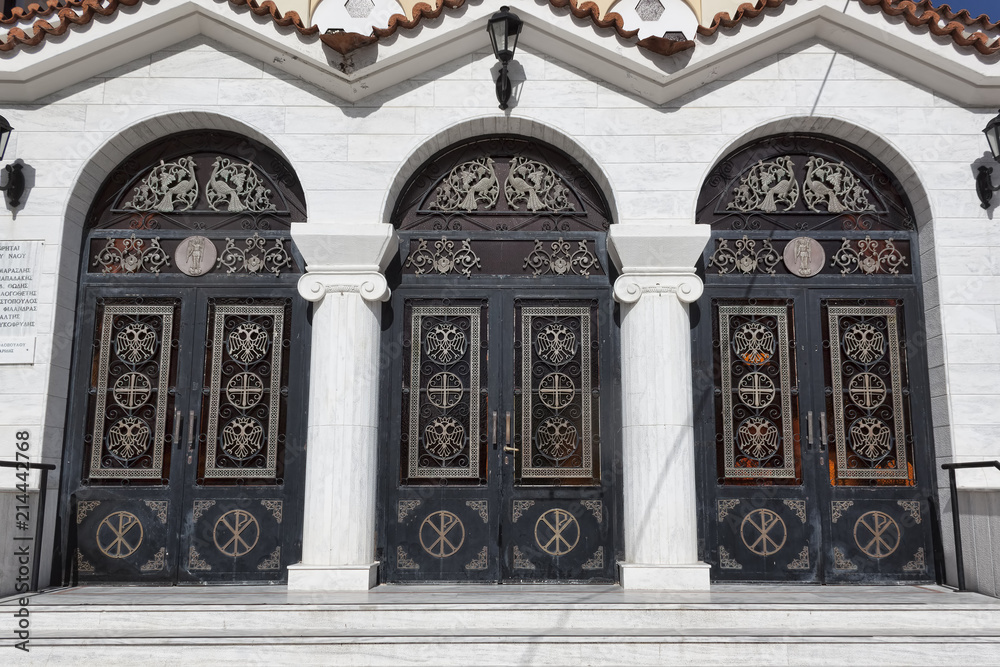 Large triple doors of the Orthodox church with decorative elements