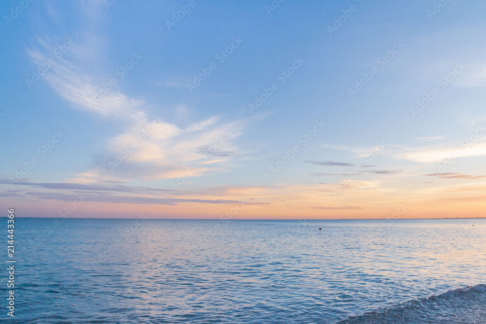 Fototapeta premium Beautiful summer sunset with clouds over the sea