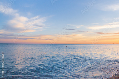 Beautiful summer sunset with clouds over the sea