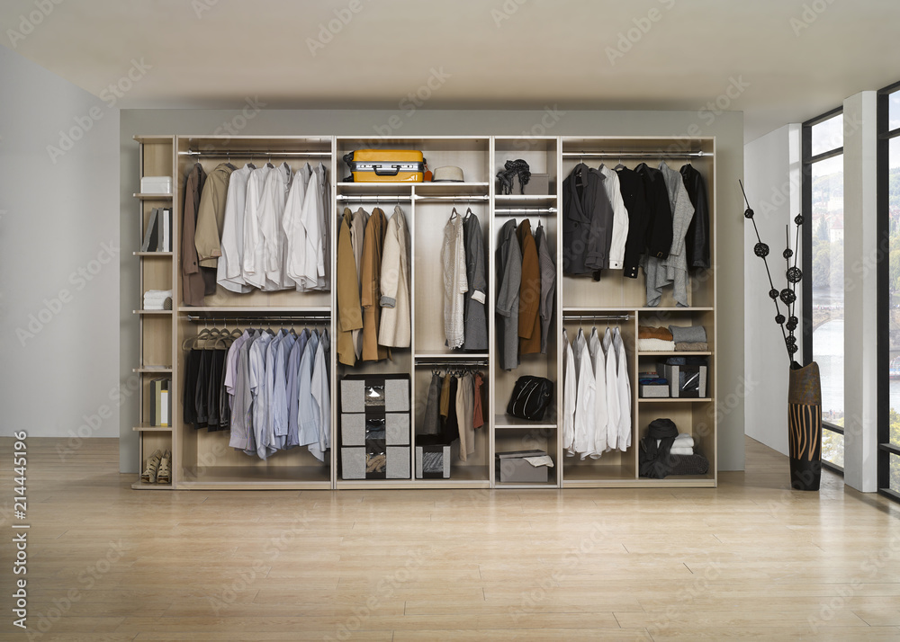 Big wardrobe with different clothes for dressing room. Interior structure of wardrobe body and shelf design. Big wardrobe with different clothes for dressing room. Interior structure of wardrobe body and shelf design.