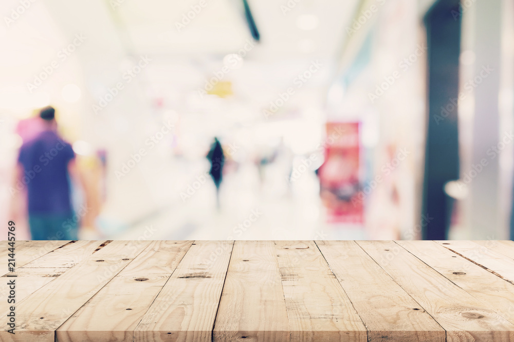 Empty wooden table and Blurred background - Store of shopping mall blur background bokeh with display montage for product. Empty wooden table and Blurred background - Store of shopping mall blur background bokeh with display montage for product.