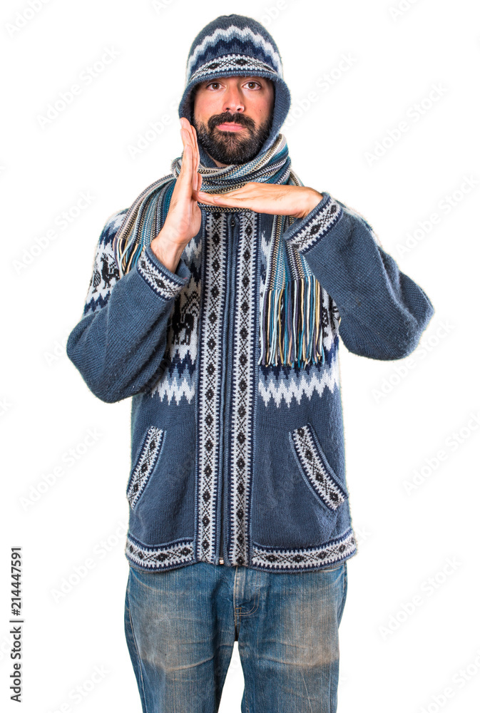 Man with winter clothes making time out gesture Man with winter clothes making time out gesture
