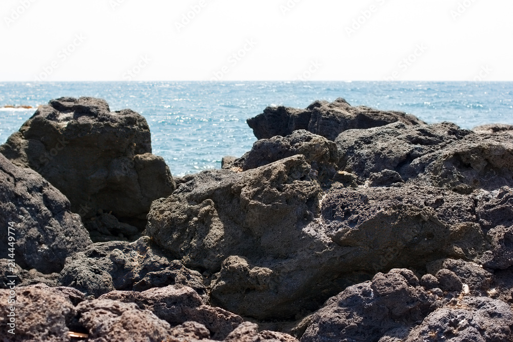 Lava, volcanic lava on beach Sicily island 