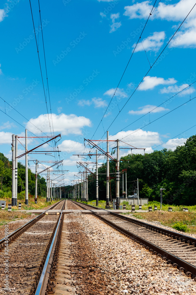Scenic railroad in rural area and blue sky with white clouds in summer Scenic railroad in rural area and blue sky with white clouds in summer