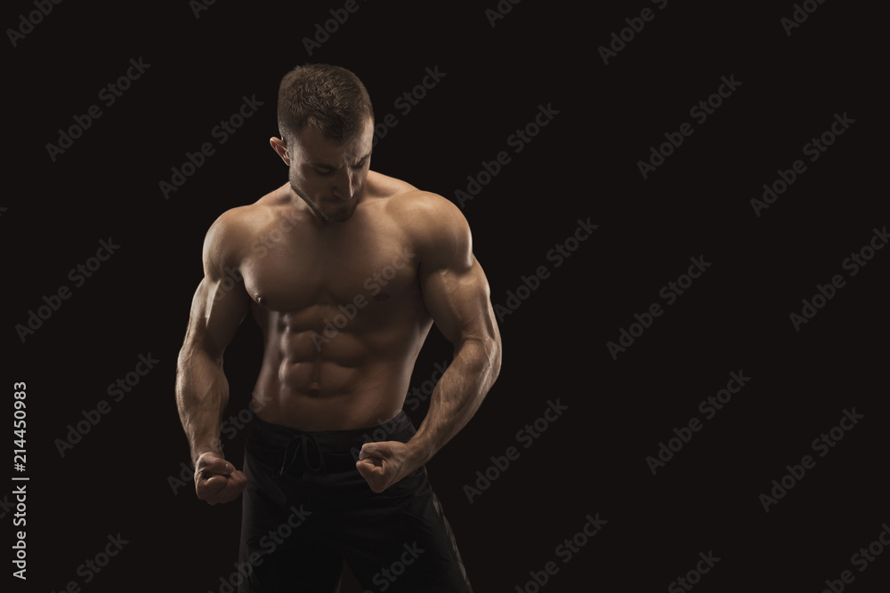 Strong athletic man showes naked muscular body Strong athletic man showes naked muscular body