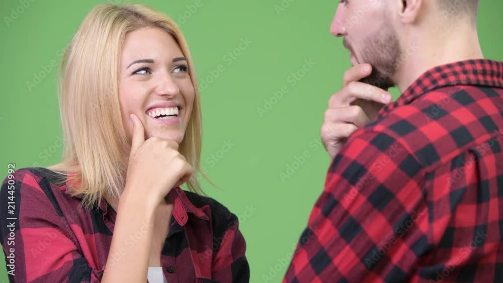 Young couple thinking while looking at each other Young couple thinking while looking at each other