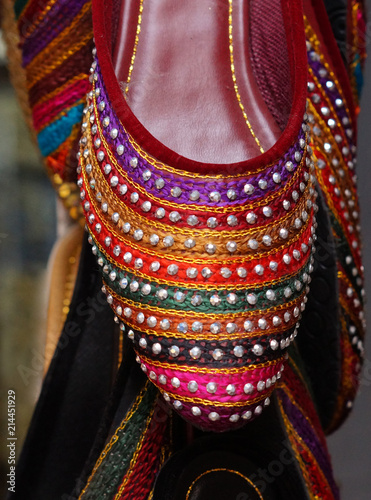  Closeup view of Indian woman footwear,in display of retail store,in the market © reddees