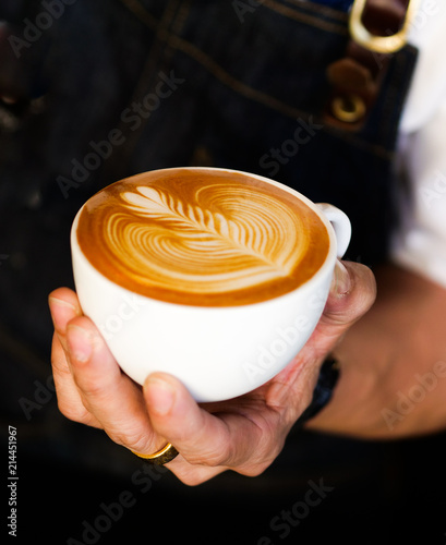 close up barista hand making a cup of coffee.